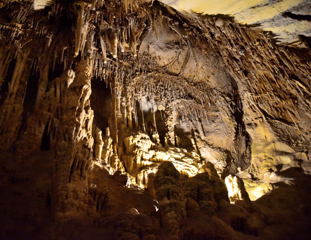 Light Shines On The Stalactites And Stalagmites In Lehman's Cave